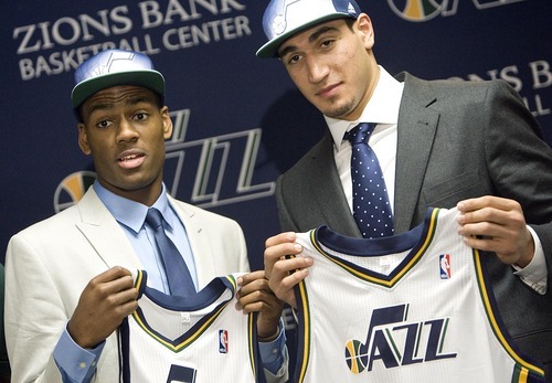 Djamila Grossman  |  The Salt Lake Tribune

The two new Jazz players, Enes Kanter and Alec Burks, hold up their new jerseys during a press conference Friday, June 24, 2011, at the Zions Bank Basketball Center in Salt Lake City, a day after the 2011 NBA draft.