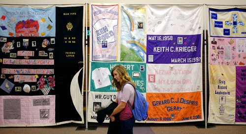 Trent Nelson  |  The Salt Lake Tribune
Paige Gardner looks over the AIDS Memorial Quilt, which was on exhibit in the Taggart Student Center at Utah State University in Logan on Wednesday. The quilt, founded in 1987, is the largest ongoing community arts project in the world, with more than 40,000 panels, each memorializing a life lost to AIDS.