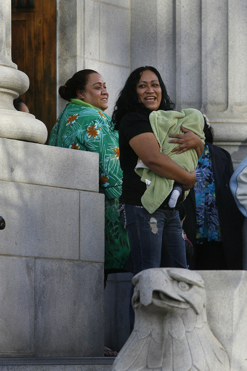 Scott Sommerdorf  |  The Salt Lake Tribune             
The family of Davey Kamoto, including his mother Mary, left, leaves the Frank E.Moss Federal Courthouse after U.S. District Court judge Tena Campbell ruled that he could be released from custody, Thursday, Dec. 1, 2011.
