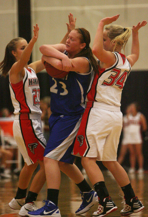 Kim Raff | The Salt Lake Tribune
Alta's (left) Makenzi Morrison and Jessica Butler put pressure on Fremont player Tanesha Daniels during a girls basketball at Alta High School in East Sandy, Utah on Wednesday, November 30, 2011.   Alta went on to win the game.