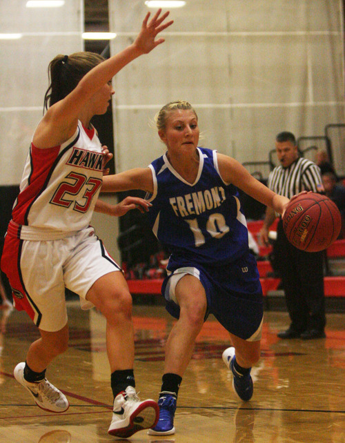 Kim Raff | The Salt Lake Tribune
Alta's Makenzi Morrison ties to contain Fremont player Mikkell Minnoch during a girls basketball at Alta High School in Sandy, Utah on Wednesday, November 30, 2011.   Alta went on to win the game.