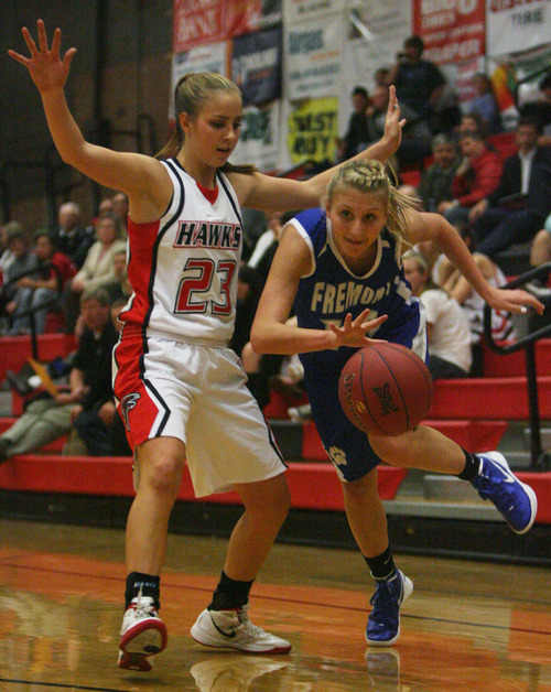 Kim Raff | The Salt Lake Tribune
Alta's Makenzi Morrison blocks as Fremont player Mikkell Monnouch drives the basket during a girls basketball at Alta High School in East Sandy, Utah on Wednesday, November 30, 2011.   Alta went on to win the game.