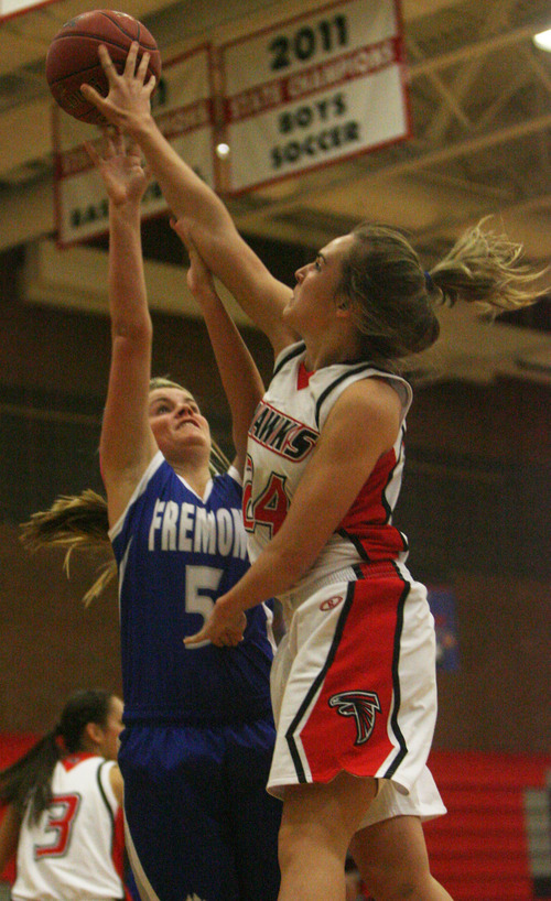 Kim Raff | The Salt Lake Tribune
Alta's Abbie Simons gets her fingures on Fremont's Dusty Kimbers shot during a girls basketball at Alta High School in East Sandy, Utah on Wednesday, November 30, 2011.   Alta went on to win the game.