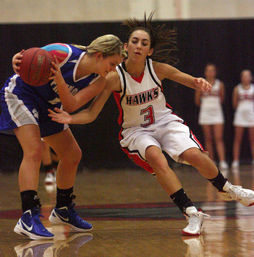 Kim Raff | The Salt Lake Tribune
Alta's player (right) Lauren Garland defends Fremont player Dusty Kimber during a girls basketball at Alta High School in East Sandy, Utah on Wednesday, November 30, 2011.   Alta went on to win the game.