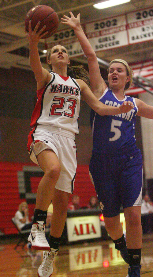 Kim Raff | The Salt Lake Tribune
Alta's Makenzi Morrison goes up for a rebound past Fremont player Dusty Kimber during a girls basketball at Alta High School in East Sandy, Utah on Wednesday, November 30, 2011.   Alta went on to win the game.