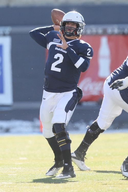 Chris Detrick  |  The Salt Lake Tribune
Utah State Aggies quarterback Adam Kennedy (2) throws the ball during the first half of the game at Romney Stadium Saturday November 26, 2011. Nevada is winning the game 10-7.