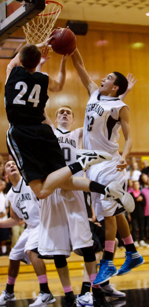 Trent Nelson  |  The Salt Lake Tribune
Highland's Lennon Betonney blocks a shot by Riverton's Stephan Holm at Highland vs. Riverton High School basketball in Salt Lake City, Utah, Friday, December 2, 2011.