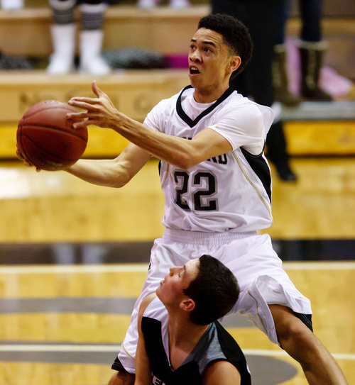 Trent Nelson  |  The Salt Lake Tribune
Highland's Liam Thomas flies to the basket for a layup at Highland vs. Riverton High School basketball in Salt Lake City, Utah, Friday, December 2, 2011. Riverton's Austin Anderson defending.