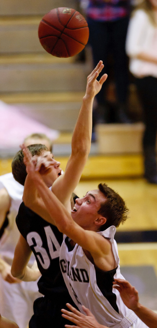 Trent Nelson  |  The Salt Lake Tribune
Highland's David Divver is blocked by Riverton's Braxton Yingling at Highland vs. Riverton High School basketball in Salt Lake City, Utah, Friday, December 2, 2011.