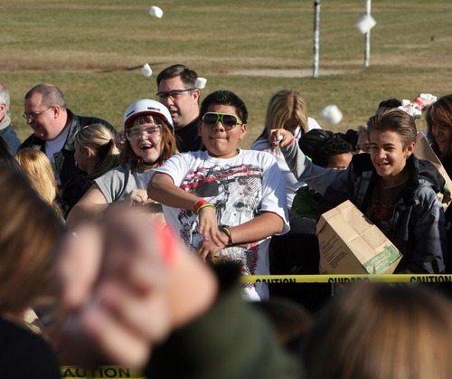Steve Griffin  |  The Salt Lake Tribune

Hundreds of students at Eisenhower Junior High School try to set a new world record for the World's Largest Marshmallow Fight by throwing or tossing nearly 2,000 pounds of 140,000 regular-sized marshmallows in about 15 minutes.in Taylorsville, Utah Friday, December 2, 2011.