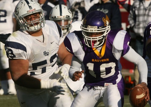 Leah Hogsten | The Salt Lake Tribune  
Eastern Arizona's quarterback Devontae Glover-Wright feels the heat from Snow's Siale Hautau who chases him out of bounds. 
Snow College defeated Eastern Arizona  36-9 during the 8th Annual Top of the Mountain Bowl Saturday, December 3 2011