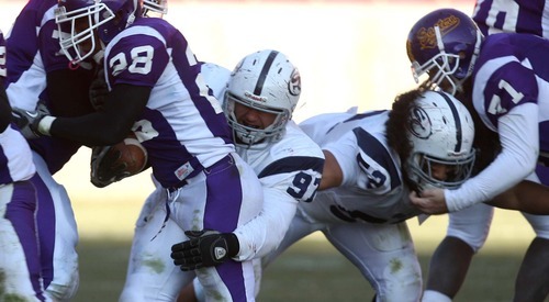 Leah Hogsten | The Salt Lake Tribune  
The Snow College defensive line stopped the Gila Monsters from advancing in the 4th including Snow's RJ Best who stops Devin Mohn. 
Snow College defeated Eastern Arizona  36-9 during the 8th Annual Top of the Mountain Bowl Saturday, December 3 2011