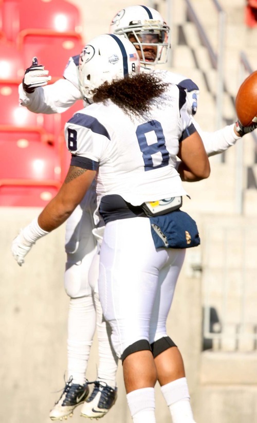 Leah Hogsten | The Salt Lake Tribune  
Snow College's Breon Allen celebrates his touchdown in the 2nd half with teammate Soni Kinikini. 
Snow College leads at the half 22-9 over Eastern Arizona  during the 8th Annual Top of the Mountain Bowl Saturday, December 3 2011