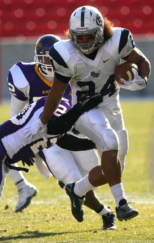 Leah Hogsten | The Salt Lake Tribune  
Snow College's Alamoti Vaenuku slips through the grasp of Eastern Arizona's Eric Walker on his 43-yard touchdown run in the 2nd quarter. 
Snow College leads at the half 22-9 over Eastern Arizona  during the 8th Annual Top of the Mountain Bowl Saturday, December 3 2011