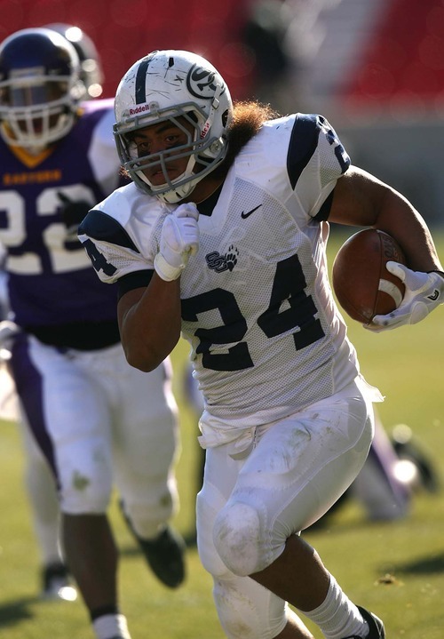 Leah Hogsten | The Salt Lake Tribune  
Snow College's Alamoti Vaenuku  on his 43-yd touchdown run in the 2nd quarter. 
Snow College leads at the half 22-9 over Eastern Arizona  during the 8th Annual Top of the Mountain Bowl Saturday, December 3 2011