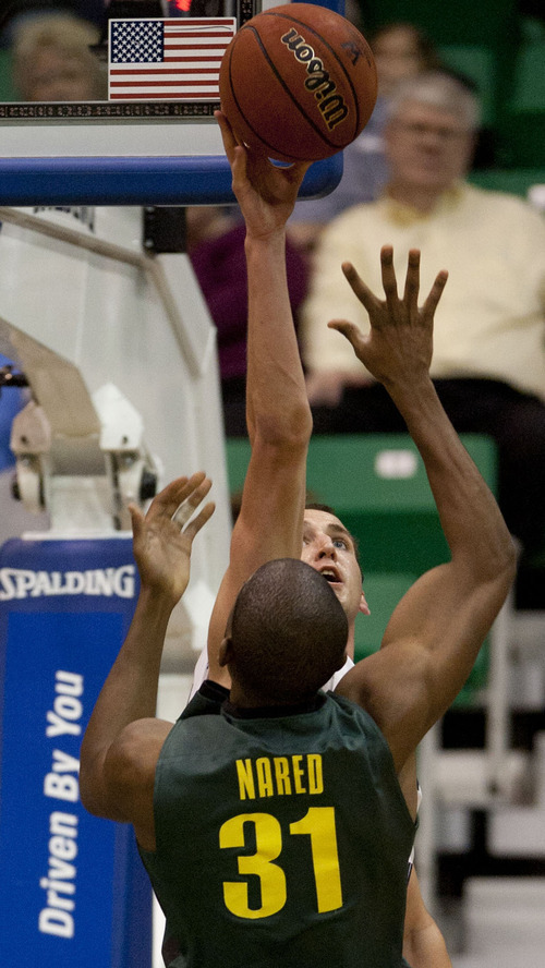 Trent Nelson  |  The Salt Lake Tribune
BYU's Noah Hartsock blocks a shot by Oregon's Tyrone Nared, at BYU vs. Oregon, college basketball at EnergySolutions Arena in Salt Lake City, Utah, Saturday, December 3, 2011.