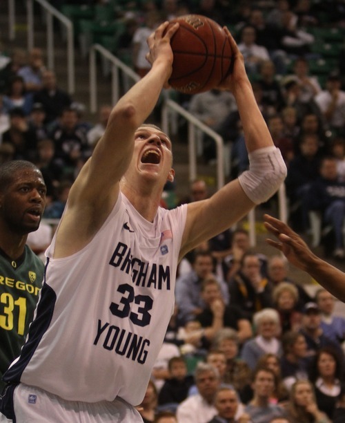 Rick Egan  | The Salt Lake Tribune 

Nate Austin (33) takes a shot for the Cougars, in first half basketball action, BYU vs Oregon, at EnergySolutions Arena, Saturday, December 3, 2011.