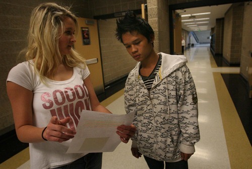 Leah Hogsten | The Salt Lake Tribune  
On the day he enrolls at Wasatch High School, KaPaw Htoo, 16, is led through his class schedule by 16-year-old Christen Ayers, Nov. 16, 2011. 
A Karen refugee, KaPaw Htoo spent his life in a Thai refugee camp before moving to Utah this summer with his parents, sister and three brothers. He started school at Cottonwood High in late August and transferred to Wasatch High School in November. He and his family do not speak English.