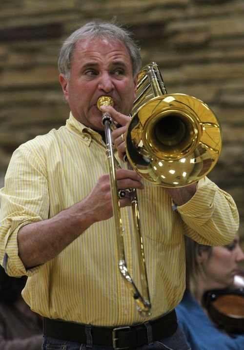 Rick Egan   |  The Salt Lake Tribune

Larry Zalkind (Utah Symphony principal trombonist), practices as  guest soloist  for The Wasatch Community Symphony during a rehearsal, Monday, October 25, 2010. The Symphony has been around since 1952.