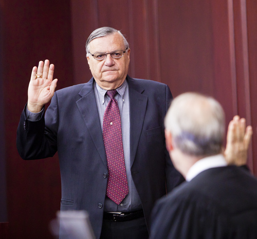 Presiding Disciplinary Judge William O'Neil, right, swears in Maricopa County Sheriff Joe Arpaio during the State Bar of Arizona's ongoing disciplinary hearings against former Maricopa County attorney Andrew Thomas and two assistants, at the Arizona Supreme Court in Phoenix Tuesday, Oct. 18, 2011.  (AP Photo/Jack Kurtz, Pool)