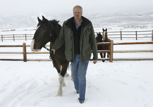 Former Jazz player and NBA record shot blocker Mark Eaton works with his horse 