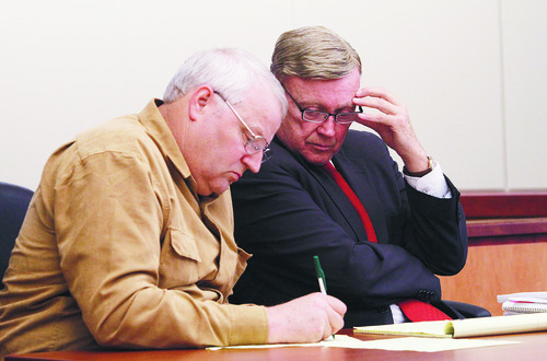 Rick Egan  | The Salt Lake Tribune 
Chuck Cox, left, father of Susan Powell, makes notes for his attorney, Stephan Downing, during a custody hearing at the Pierce County Superior Courthouse in Tacoma, Wash., in September.