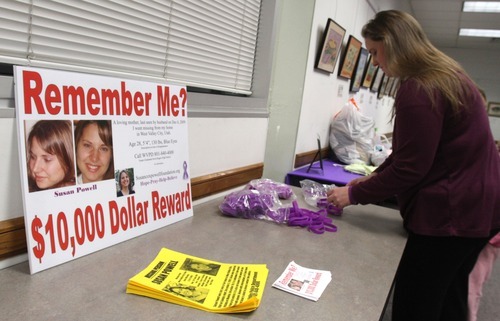 Rick Egan  | The Salt Lake Tribune 

Jennifer Graves sets up a table Monday for people to leave donations. Friends and family of missing West Valley City woman Susan Cox Powell gathered donations for the Christmas Box House, at the Hunter Library in West Valley City.
