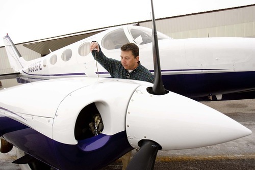 TRENT NELSON | Tribune File Photo
Rep. Stephen Sandstrom in a newly filed financial disclosure reports a net worth -- including the value of his business -- at some $11 million. In this file photo, taken last January, he does a pre-flight inspection of his airplane (a Cessna 340) at the Spanish Fork-Springville Airport.