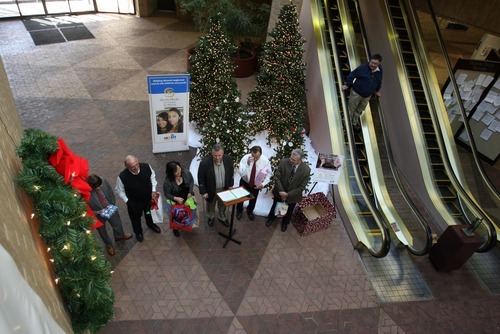 Steve Griffin  |  The Salt Lake Tribune

Salt Lake County Mayor Peter Corroon, center, and other Salt Lake County elected officials placed presents under Christmas trees at the Salt Lake County Government Center on Tuesday, December 6, 2011, kicking off a drive to collect Christmas gifts for children in the county's Youth Services and Shelter programs. The Salt Lake County Government Center will feature wish list items on a tree decorated with hand-crafted ornaments created by Your Service children. Residents can claim a wish list ornament and donate the items on the child's list.