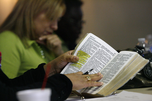 Scott Sommerdorf  |  The Salt Lake Tribune             
As Silvia Bayani (foreground) reads a passage from Romans, Mary Flores, top, listens during a recent meeting at The Vine Institute.