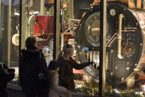 Paul Fraughton | The Salt Lake Tribune

Passersby stop to look at the Christmas window Monday at Deseret Book Store on South Temple Street in downtown Salt Lake City. The window features a whimsical  