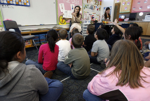 Francisco Kjolseth  |  The Salt Lake Tribune
Geneva Elementary School second-grade teacher Sandy Gustin, center, reads to her students in Orem on Tuesday, Dec. 6, 2011. The Alpine school district is now the state's largest school district, according to newly released enrollment numbers.