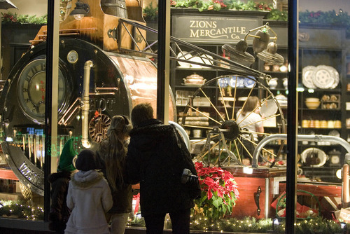 Paul Fraughton | The Salt Lake Tribune

Passersby stop to look at the Christmas window Monday at Deseret Book Store on South Temple Street in downtown Salt Lake City. The window features a whimsical  