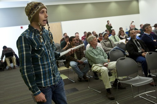 Chris Detrick  |  The Salt Lake Tribune
Jake Hanson leads members of Occupy SLC and Peaceful Uprising in voicing their concerns during the state's Air Quality Board meeting at the Multi-Agency Building on Wednesday.