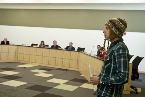 Chris Detrick  |  The Salt Lake Tribune
Jake Hanson leads members of Occupy SLC and Peaceful Uprising in voicing their concerns during the state's Air Quality Board meeting at the Multi-Agency Building on Wednesday.