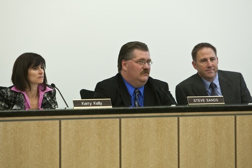 Chris Detrick  |  The Salt Lake Tribune
Kerry Kelly, Steve Sands and Bryce Bird listen as members of Occupy SLC and Peaceful Uprising voice their concerns during the state's Air Quality Board meeting at the Multi-Agency Building on Wednesday.