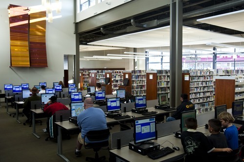 Chris Detrick | The Salt Lake Tribune
Visitors use the computers inside of the Magna library. The library has seen foot traffic increase by one-third since moving to historic Magna Main Street.
