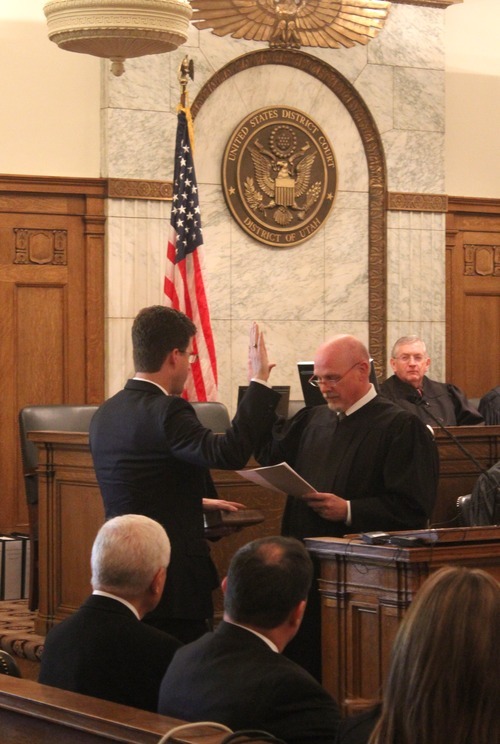 Rick Egan  | The Salt Lake Tribune 

David B. Barlow (left) takes the oath of office as Chief Judge Ted Steward presides, during his investiture ceremony as the new U.S. Attorney, in Judge Benson's courtroom in the Frank E. Moss U.S. Courthouse, Friday, December 9, 2011.