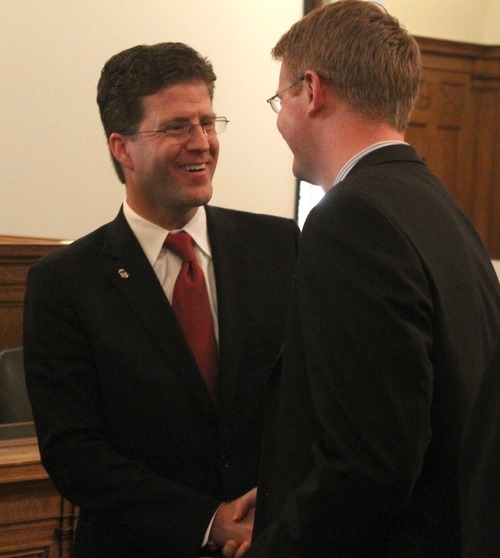 Rick Egan  | The Salt Lake Tribune 

David B. Barlow visits with Ricky Bower, after his investiture ceremony as a new U.S. Attorney, in Judge Benson's courtroom in the Frank E. Moss U.S. Courthouse, Friday, December 9, 2011.