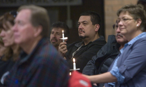 Al Hartmann  |  The Salt Lake Tribune  
Union members with AFL-CIO hold candles Thursday, Dec. 8, during a prayer vigil for Utah families affected by job los. During the vigil, held at the Union Labor Center, Utahns talked about the struggle to find work, pay bills and support their families.
