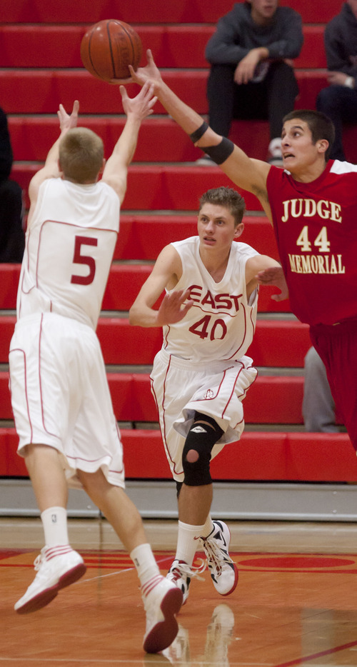 Trent Nelson  |  The Salt Lake Tribune
Judge's Alex Mancini (44) tips the ball away from East's Parker Van Dyke (5) as East faced Judge Memorial High School boys' basketball in Salt Lake City, Utah, Wednesday, December 7, 2011. East's Bryce Williams at center.