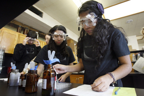 Francisco Kjolseth  |  The Salt Lake Tribune
Chemistry students Rebecca Angiano, 16, center, and Maria Garcia, 15, learn about forensics as they try to determine how a person was killed by poison as part of a class experiment at the Center for Science Education in Salt Lake City on Thursday.