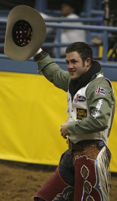 Rick Egan  | The Salt Lake Tribune 

Kaycee Feild, Payson, waves to the crowd after his first place bull ride, at the National Finals Rodeo, in Las Vegas, Thursday, Dec. 8, 2011.
