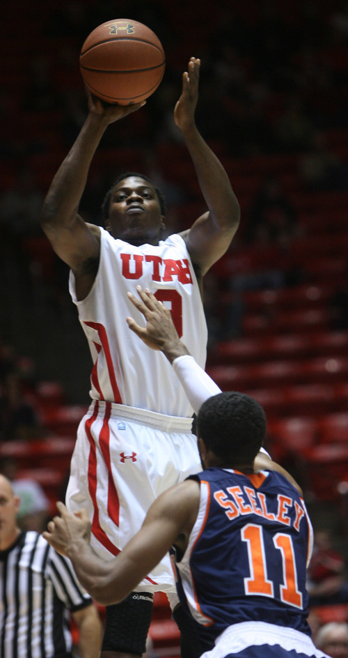 Kim Raff | The Salt Lake Tribune
Utah's Anthony Odunsi goes up for a jump shot while being defended by Cal State-Fullerton's D.J. Seeley at the Huntsman Center on Wednesday.