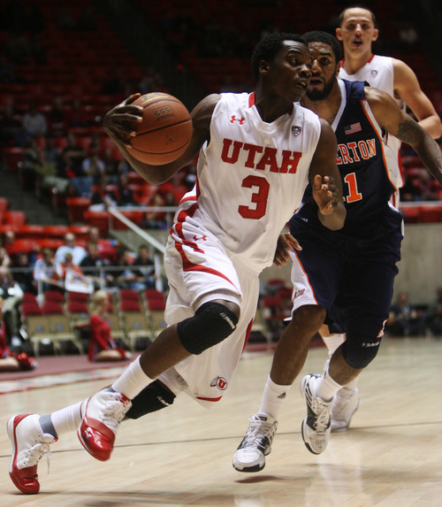 Kim Raff | The Salt Lake Tribune
Utah's Anthony Odunsi drives tp the basket against
Cal State-Fullerton at the Huntsman Center on Wednesday.