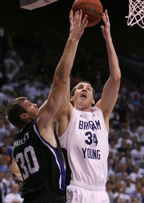 Steve Griffin  |  The Salt Lake Tribune

BYU's Noah Hartscok shoots over Weber State's Darin Mahoney during first half action in the BYU versus Weber State men's basketball game at the Marriott Center in Provo, Utah Wednesday, December 7, 2011.