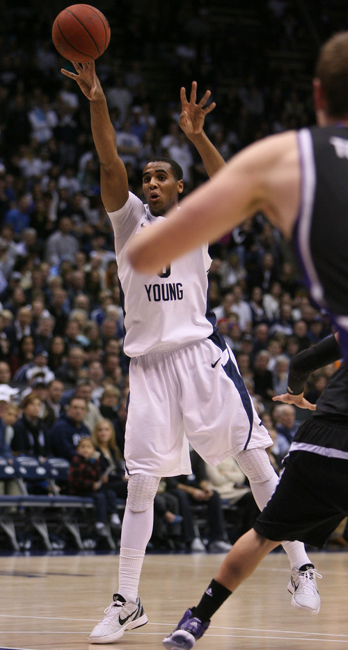 Steve Griffin  |  The Salt Lake Tribune

BYU's Brandon Davies lobs the ball into the post during first-half action versus Weber State at the Marriott Center in Provo on Wednesday, December 7, 2011.