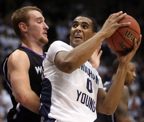 Steve Griffin  |  The Salt Lake Tribune
BYU's Brandon Davies turns into Weber State's Kyle Tresnak during first-half action versus Weber State at the Marriott Center in Provo on Wednesday, December 7, 2011.