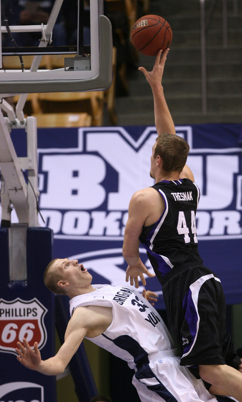 Steve Griffin  |  The Salt Lake Tribune

Weber State's Kyle Tresnak crashes into BYU's Nate Austin as he tries to shoot during first-half action versus Weber State at the Marriott Center in Provo on Wednesday, December 7, 2011.