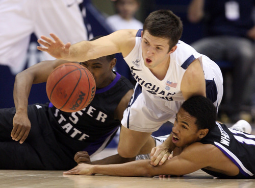 Steve Griffin  |  The Salt Lake Tribune

Weber State's Jordan Richardson, left, and Gelaun Wheelwright dive to the floor as they battle BYU's Craig Cusick for the ball during first-half action versus Weber State at the Marriott Center in Provo on Wednesday, December 7, 2011.